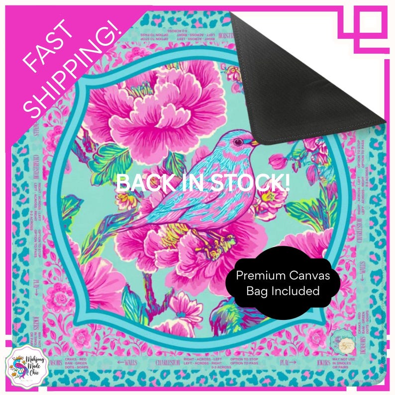 May include: A decorative mat featuring a vibrant bird design with pink and blue hues, surrounded by pink flowers on a teal background. The mat includes the text "BACK IN STOCK!" and "FAST SHIPPING!" and comes with a premium canvas bag.
