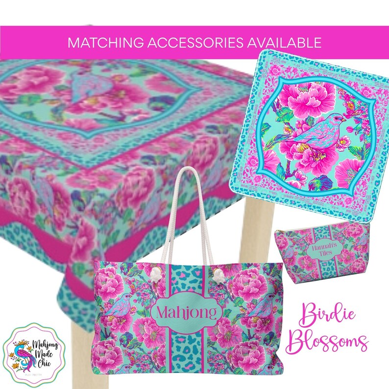 May include: A set of accessories with a floral and bird design. The set includes a tote bag, a square decorative piece, a small pouch, and a tablecloth. The color scheme features pink, turquoise, and white. The tote bag has the word "Mahjong" on it.