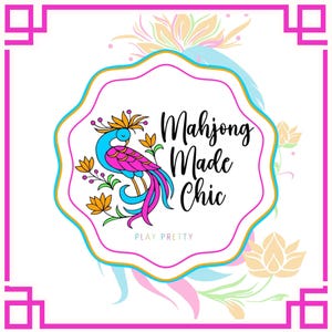 May include: A white background with a pink and gold border surrounds a central design. The design features a colorful bird with the text "Mahjong Made Chic" and "Play Pretty". The bird is blue, pink, and yellow.