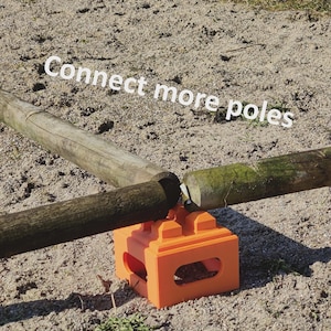 May include: A bright orange plastic connector block with four circular attachment points on top, supporting three weathered wooden poles. The text "Connect more poles" is overlaid in white across the top of the image.