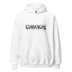May include: White hooded sweatshirt with the word "COMANCHE" printed across the chest. The text is in a distressed style, with a dripping effect. The sweatshirt has a front pocket and a drawstring hood.
