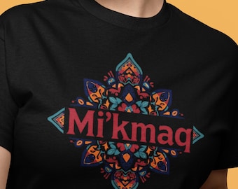 May include: Black t-shirt featuring a colorful, symmetrical design with the word "Mi'kmaq" in red. The design includes teal, orange, and blue floral and geometric elements, creating a vibrant and eye-catching graphic.