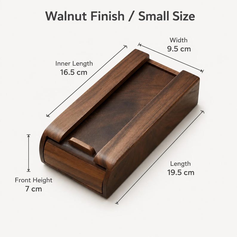 May include: A rectangular wooden box with a walnut finish. The box features a sliding lid and measures 9.5 cm in width, 19.5 cm in length, and 7 cm in front height, with an inner length of 16.5 cm. The text Walnut Finish / Small Size is visible.