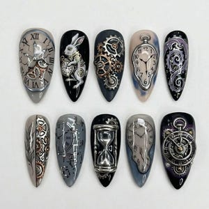 May include: A set of ten long, almond-shaped artificial nails with steampunk-themed designs. Each nail features a different design, including clocks, gears, and a rabbit with a pocket watch, in shades of silver, gold, black, and gray.