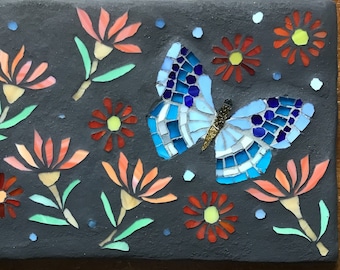 Blue Butterfly in meadow. Outdoor mosaic artwork