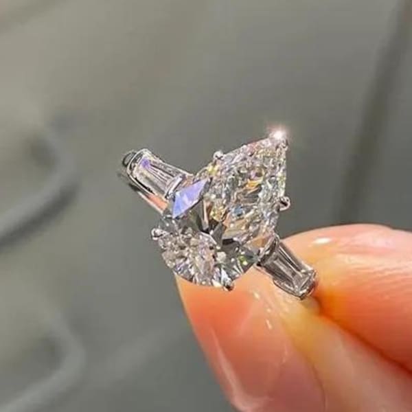 Pear Cut Moissanite Engagement Ring: Sterling Silver 3-Stone Baguette Setting