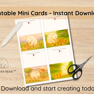 May include: Printable mini cards featuring a bear illustration with text including "Some gifts don't need wrapping" and "Kindness travels far". The image also shows scissors and a bone folder. The text "Download and start creating today!" is also visible.