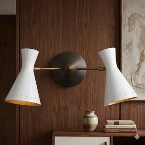 May include: A rustic wooden sign with the text "Welcome to our home" in white lettering. The sign features a distressed finish and a simple, inviting design, perfect for entryway decor.