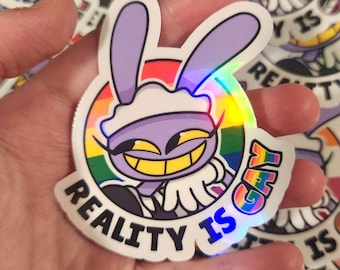 TADC "Reality is Gay" Jax - Waterproof Holographic Pride Stickers