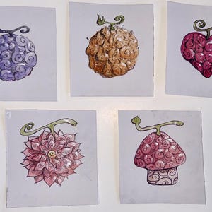 May include: Five square illustrations on light gray paper featuring stylized fruit designs. The top row shows a purple swirl fruit, a textured tan fruit, and a heart-shaped pink fruit. The bottom row displays a pink flower-like fruit and a mushroom-shaped fruit.