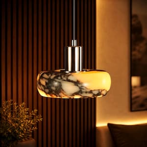 May include: A modern pendant light with a marble-patterned shade. The shade is a mix of white, gray, and yellow, with a polished metal fixture. The light hangs from a thin wire, suitable for a bedroom or living room.
