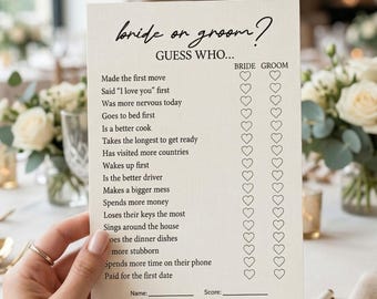 May include: A rectangular off-white card featuring the black printed text bride or groom? guess who... followed by a list of questions and two columns of heart icons for marking answers. The card includes blank lines for name and score at the bottom.