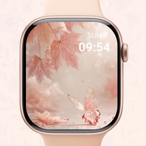 May include: A rose gold smartwatch with a light pink band. The watch face displays a digital clock showing the time 09:54 and the day of the week. The screen features a pink butterfly, heart, and maple leaves.