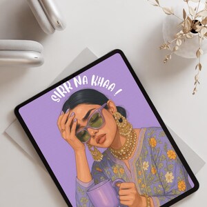 May include: Tablet with a purple screen displaying an illustration of a woman wearing sunglasses and holding a mug. The text "SIRR NA KHAA!" is written on the screen. Gold jewelry and a floral patterned top are also visible.