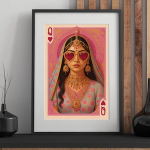 May include: Framed art print featuring a stylized illustration of a woman as the Queen of Hearts playing card. She wears heart-shaped sunglasses, ornate gold jewelry, and a traditional head covering. The color palette includes pink, gold, and blue.