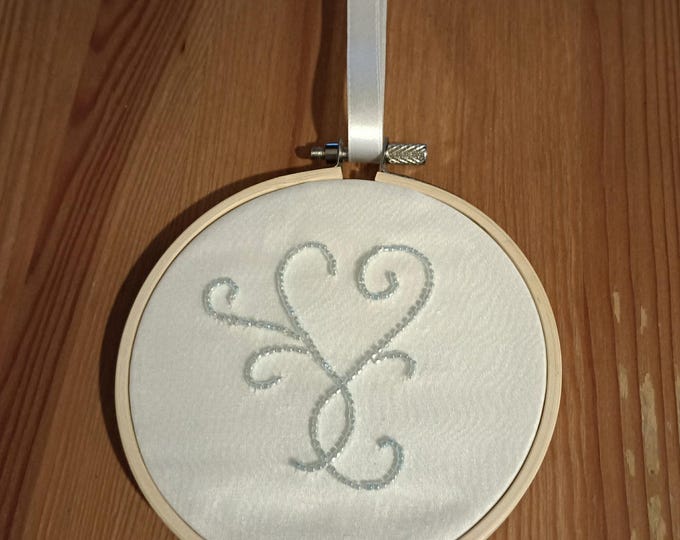 Hand beaded hanging decoration on silk in bamboo hoop