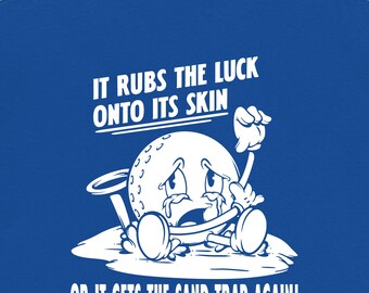 It Rubs the Luck Onto Its Skin Golf Shirt | Funny Sand Trap Humor Tee | Vintage Cartoon Golf Ball Shirt | Golfer Gift