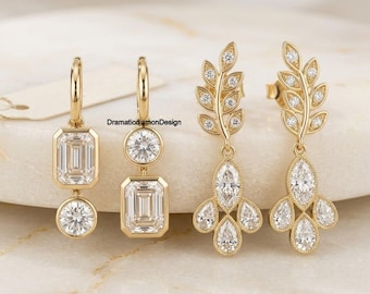 象徴的なベゼルセッティングのエメラルド＆ラウンドカットモアッサナイトイヤリング、14Kイエローゴールドのクリップ式ダイヤモンドイヤリング、リーフモチーフのドロップイヤリング