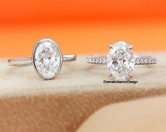 Anillo de diamantes con moissanita de talla ovalada de 10 x 7 mm, engaste biselado, solitario con diamantes de acento, oro blanco de 14k.