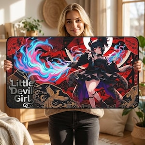 May include: A rectangular black desk mat featuring a vibrant anime-style illustration of a character in a black outfit with red accents. The mat has the text "Little Devil Girl" and a decorative red and gold background.