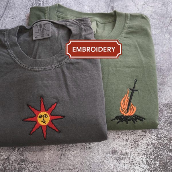 Camisa de juego Guerrero de la luz del sol Ríos de sangre Katana Juegos de almas Demons Souls Estética de hoguera Anillo de vida Gema de fuego Semilla dorada