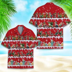 May include: Red short-sleeved button-down shirt featuring a festive design. The shirt showcases a repeating pattern of dinosaurs dressed in Santa hats and Christmas attire, with snowflakes and a snowy landscape. The bottom of the shirt has a row of colorful houses.