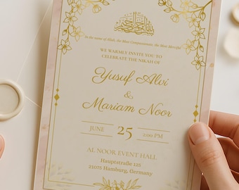 May include: A wedding invitation with a cream-colored envelope sealed with a wax stamp is held next to the invitation card. The card has gold floral accents and text that reads "Yusuf Alvi & Mariam Noor, June 25".