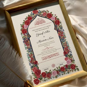 May include: A framed marriage certificate with gold trim, featuring the names Yusuf Alvi and Mariam Noor. The document is adorned with a floral border of red and pink roses, with text in English and Arabic script.