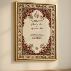 May include: A framed marriage certificate with a decorative floral border in red, green, and gold. The certificate features the names Yusuf Alvi and Mariam Noor, with text in English and Arabic calligraphy. The frame is gold.