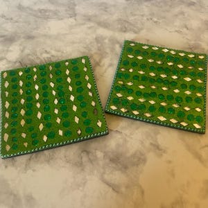 May include: A set of three ceramic mugs with a speckled, matte finish. The mugs are in shades of cream, light gray, and dark gray. Each mug has a simple, minimalist design, perfect for coffee or tea.