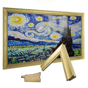 May include: A framed print of Van Gogh's "Starry Night" with a gold-colored frame. A detached corner of the frame and a wooden piece are visible. The artwork depicts a night sky with swirling clouds and stars over a village.