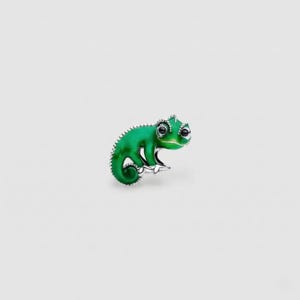 May include: A green chameleon brooch with a silver-colored trim. The brooch has a glossy finish and detailed features, including black eyes and a curled tail. The jewelry piece is set against a plain white background.