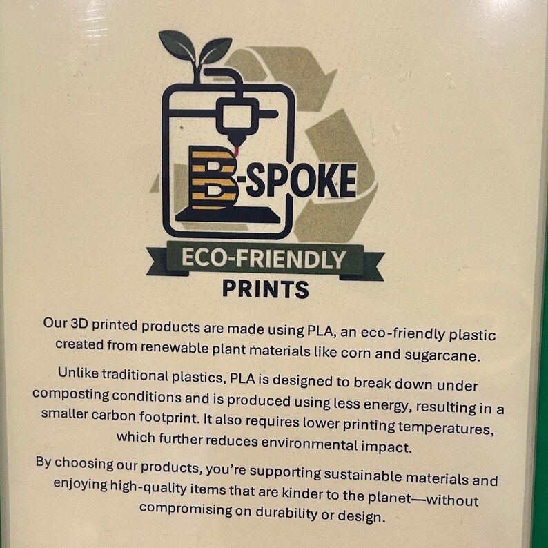 May include: An image with the text "B-SPOKE ECO-FRIENDLY PRINTS". The graphic shows a 3D printer with a plant sprout on top. The text below states the products are made with eco-friendly plastic from renewable plant materials.