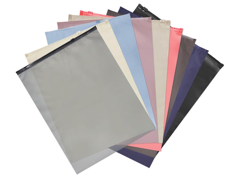 May include: A collection of colorful, rectangular zipper pouches in various shades, including gray, pink, blue, and black. Each pouch has a black zipper closure and is arranged in a fan shape.