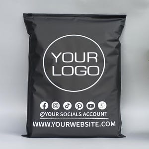 May include: Black poly mailer bag with a white circular logo area that says "YOUR LOGO". Below the logo are social media icons and the text "@YOUR SOCIALS ACCOUNT" and "WWW.YOURWEBSITE.COM".