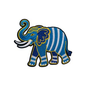 May include: Embroidered elephant patch in shades of blue and white, with yellow and black detailing. The elephant features a striped body and detailed trunk. Suitable for jackets, bags, or other fabric items.