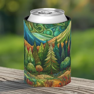 May include: A can cooler featuring a colorful forest and mountain landscape design. The artwork includes shades of green, blue, yellow, and orange. The cooler is made of a black material and is designed to keep beverages cold.