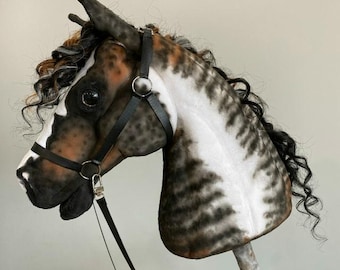 Cavallo a dondolo pezzato: gioco da giardino per bambini