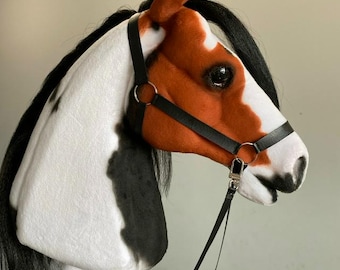 Cavallo di peluche pezzato: giocattolo saltellante