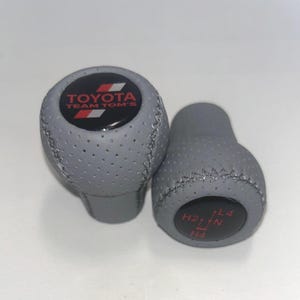 Ensemble de pommeaux de levier de vitesse de style ancien pour transmission automatique Tundra, Sienna, RAV4, FJ Cruiser, en cuir perforé gris avec surpiqûres grises