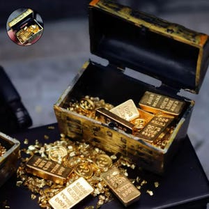 May include: A small, open treasure chest overflowing with gold coins and bars. The chest is black with gold trim and is filled with gold bars that read "1008 GOLD". Gold flakes are scattered around the chest.