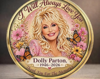 May include: A round gold-toned commemorative coin featuring a portrait of Dolly Parton with blonde hair, surrounded by pink and yellow flowers and two monarch butterflies. Text reads: I Will Always Love You, Dolly Parton, 1946-2026, Thank You For The Memories.