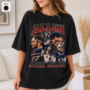 May include: A black short-sleeve t-shirt featuring a vintage-style graphic print of football player Josh Allen. The design includes multiple action shots of the athlete in a blue and red uniform, with the text ALLEN and JOSH ALLEN in red.