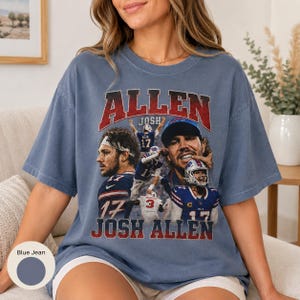 May include: A blue jean colored t-shirt featuring a graphic print of Josh Allen. The design includes multiple images of the football player in action, the text "ALLEN" in red, and "JOSH ALLEN" in white, with a distressed vintage aesthetic.