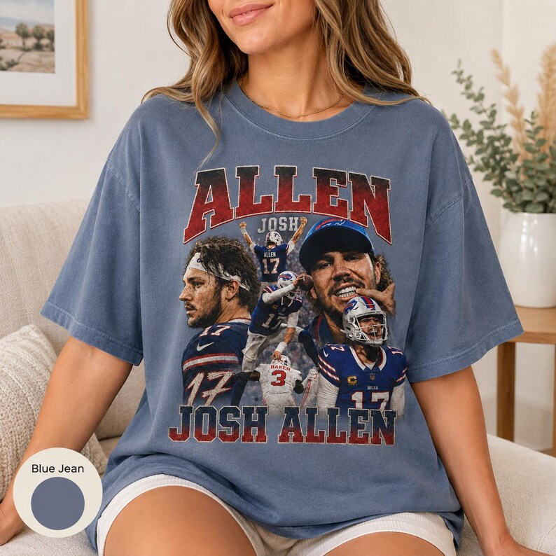 May include: A blue jean colored t-shirt featuring a graphic print of Josh Allen. The design includes multiple images of the football player in action, the text "ALLEN" in red, and "JOSH ALLEN" in white, with a distressed vintage aesthetic.