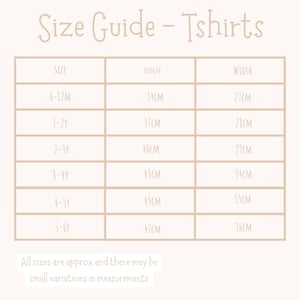 May include: A beige t-shirt size guide, titled "Size Guide - Tshirts". It details sizes from 6-12 months to 5-6 years, with length and width measurements in centimetres. The text "All sizes are approx and there may be small variations in measurements" is at the bottom.