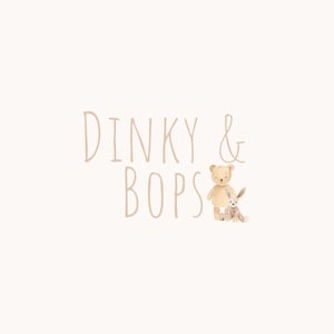 May include: A cream-coloured background with the words "Dinky & Bops" in a soft brown font. A watercolour illustration of a teddy bear and a bunny are to the right of the text.