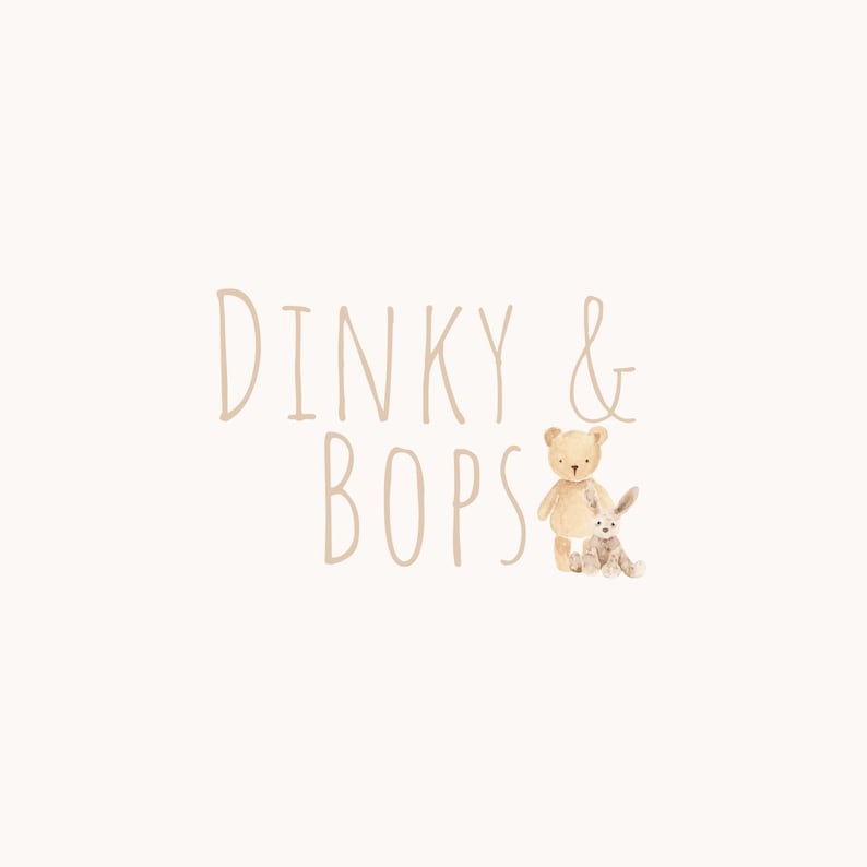 May include: A cream-coloured background with the words "Dinky & Bops" in a soft brown font. A watercolour illustration of a teddy bear and a bunny are to the right of the text.