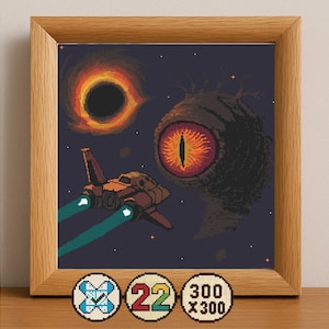 May include: A framed pixel art piece depicting a space scene with a black hole, a large eye, and a spaceship. The artwork features a dark blue background with stars, and the spaceship has blue exhaust trails. The frame is made of wood.
