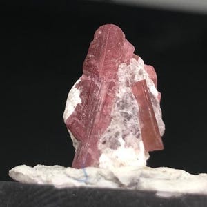 May include: A rustic wooden sign with the text "Welcome to our home" in white lettering. The sign features a distressed finish and a simple, inviting design, perfect for a front porch or entryway.